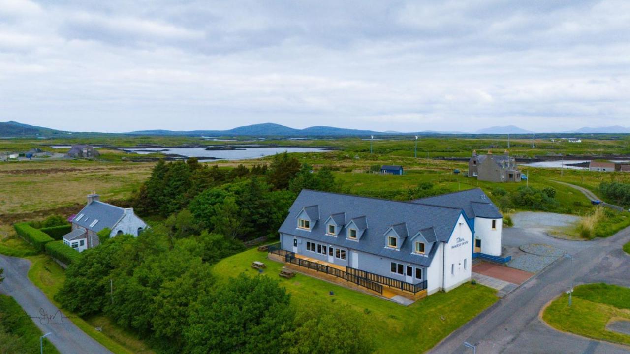 Aerial view of the white hotel building in Lochmaddy